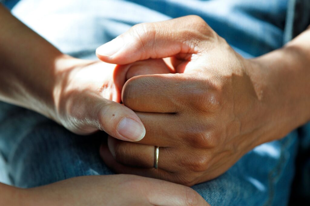 Hands held in a gesture of care and reassurance