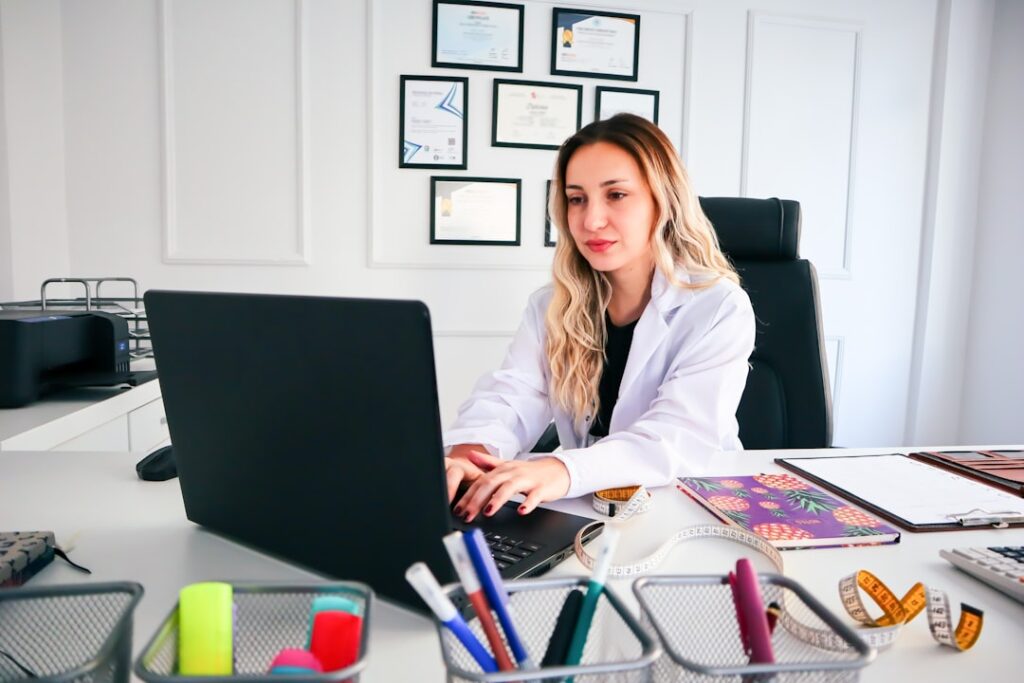 Professional researching international healthcare career options on a laptop